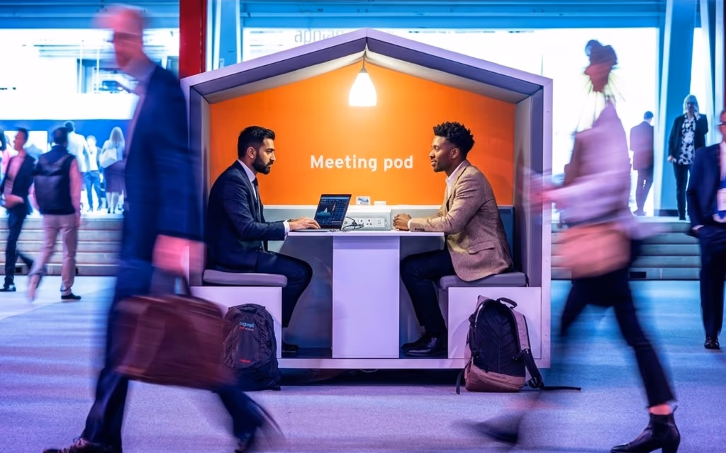 Business travel in the Netherlands — professionals in a meeting pod at an Amsterdam congress
