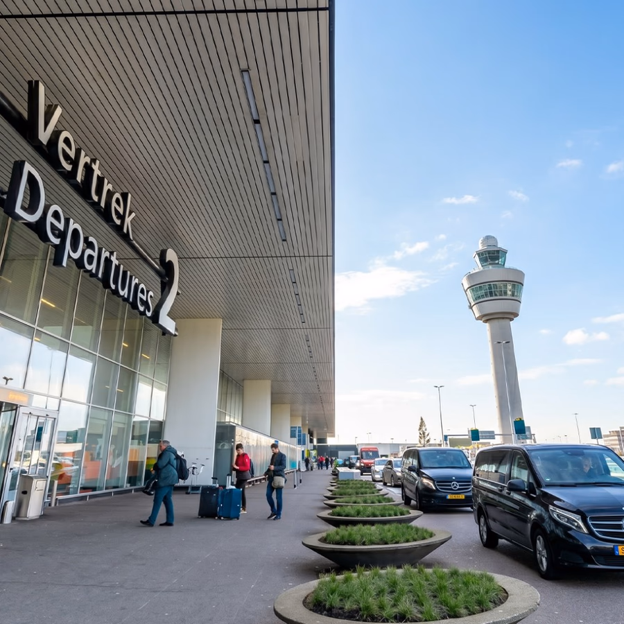 Mercedes chauffeur vans waiting outside Amsterdam Airport Schiphol Departures 2 terminal